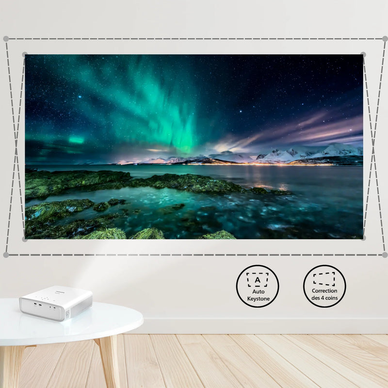 Projector displaying a scenic image of the Northern Lights over a landscape on a wall. Philips NeoPix 550 Smart Projector | White | Connec It Ireland