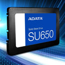 ADATA SU650 solid state drive in a black rectangular form factor with a blue and white label, shown on a blue digital background with binary code.